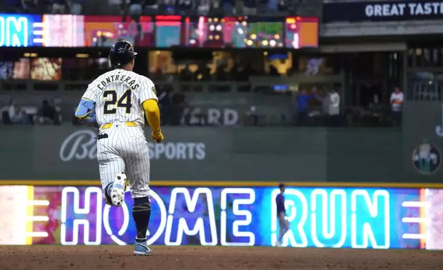 Milwaukee Brewers' William Contreras runs the bases after hitting a two-run home run during the third inning of a baseball game against the Colorado Rockies, Saturday, Sept. 7, 2024, in Milwaukee. (AP Photo/Kayla Wolf)