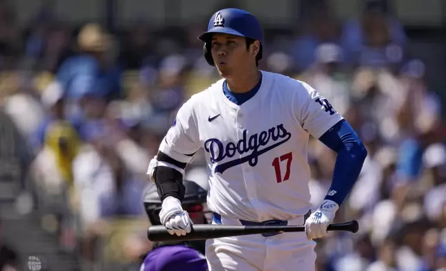 Los Angeles Dodgers' Shohei Ohtani reacts to taking a strike during the first inning of a baseball game against the Colorado Rockies, Sunday, Sept. 22, 2024, in Los Angeles. (AP Photo/Mark J. Terrill)