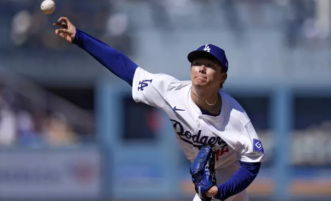 Los Angeles Dodgers starting pitcher Yoshinobu Yamamoto throws to the plate during the second inning of a baseball game against the Colorado Rockies, Sunday, Sept. 22, 2024, in Los Angeles. (AP Photo/Mark J. Terrill)