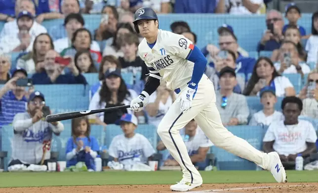 Los Angeles Dodgers designated hitter Shohei Ohtani (17) runs as he grounds out during the first inning of a baseball game against the Colorado Rockies in Los Angeles, Saturday, Sept. 21, 2024. (AP Photo/Ashley Landis)