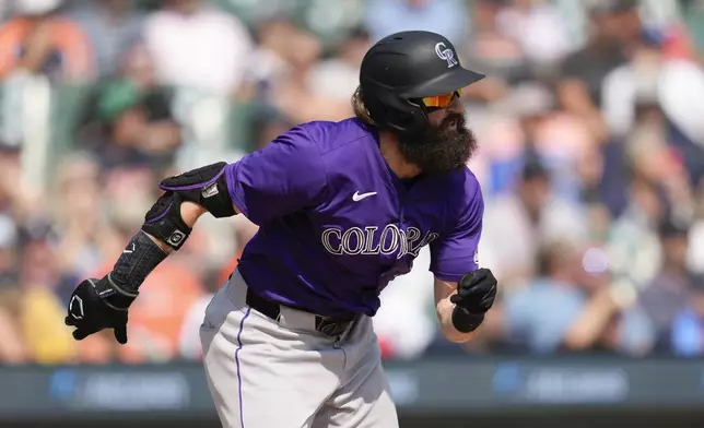 Colorado Rockies' Charlie Blackmon runs out a one-run single against the Detroit Tigers in the seventh inning of a baseball game, Thursday, Sept. 12, 2024, in Detroit. (AP Photo/Paul Sancya)