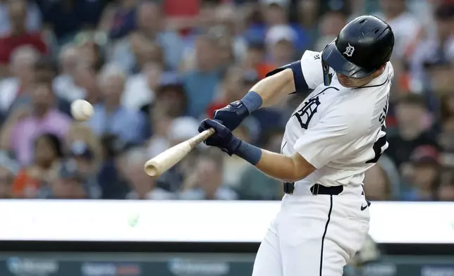 Detroit Tigers' Trey Sweeney hits a three-run home run against the Colorado Rockies during the first inning of a baseball game, Wednesday, Sept. 11, 2024, in Detroit. (AP Photo/Duane Burleson)