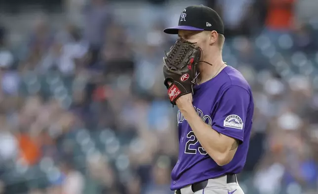 Colorado Rockies starter Tanner Gordon reacts after giving up a home run to Detroit Tigers' Trey Sweeney during the first inning of a baseball game, Wednesday, Sept. 11, 2024, in Detroit. (AP Photo/Duane Burleson)