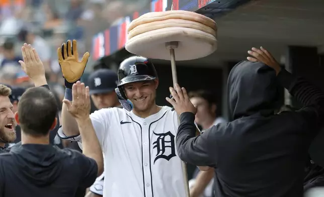 Detroit Tigers' Parker Meadows celebrates after hitting a home run against the Colorado Rockies during the first inning of a baseball game, Tuesday, Sept. 10, 2024, in Detroit. (AP Photo/Duane Burleson)