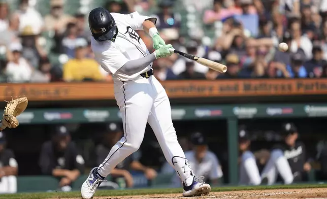 Detroit Tigers' Spencer Torkelson hits a two-run double against the Colorado Rockies in the fourth inning of a baseball game, Thursday, Sept. 12, 2024, in Detroit. (AP Photo/Paul Sancya)