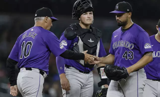 Colorado Rockies pitcher Anthony Molina is pulled by manager Bud Black (10), with catcher Hunter Goodman looking on, during the sixth inning of a baseball game against the Detroit Tigers, Tuesday, Sept. 10, 2024, in Detroit. (AP Photo/Duane Burleson)