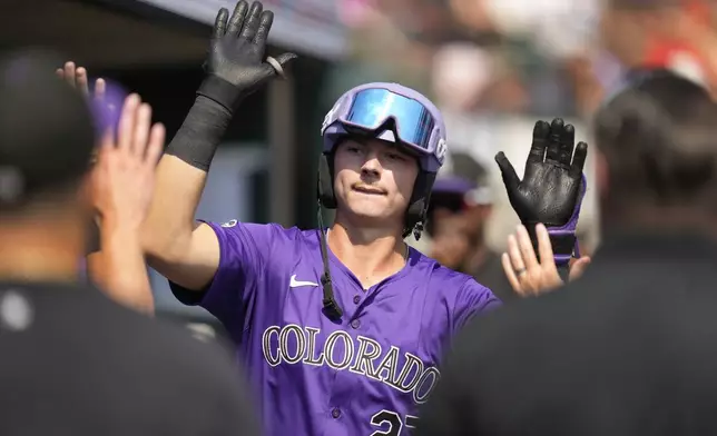 Colorado Rockies' Jordan Beck celebrates his home run against the Detroit Tigers in the third inning of a baseball game, Thursday, Sept. 12, 2024, in Detroit. (AP Photo/Paul Sancya)