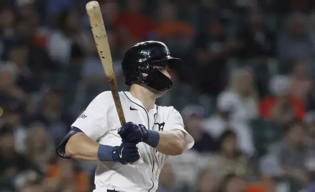 Detroit Tigers' Trey Sweeney singles against the Colorado Rockies during the sixth inning of a baseball game, Tuesday, Sept. 10, 2024, in Detroit. (AP Photo/Duane Burleson)