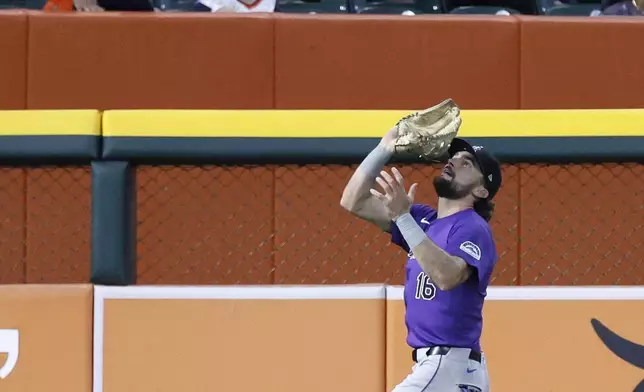 Colorado Rockies left fielder Sam Hilliard (16) makes the catch on a fly ball hit by Detroit Tigers' Colt Keith during the fifth inning of a baseball game Tuesday, Sept. 10, 2024, in Detroit. (AP Photo/Duane Burleson)