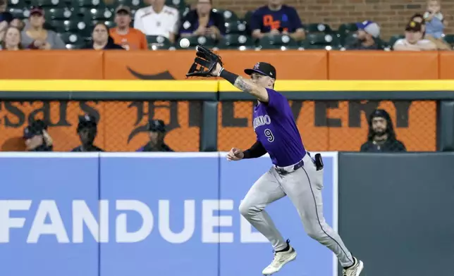 Colorado Rockies center fielder Brenton Doyle catches a fly ball hit by Detroit Tigers' Spencer Torkelson during the fifth inning of a baseball game, Wednesday, Sept. 11, 2024, in Detroit. (AP Photo/Duane Burleson)