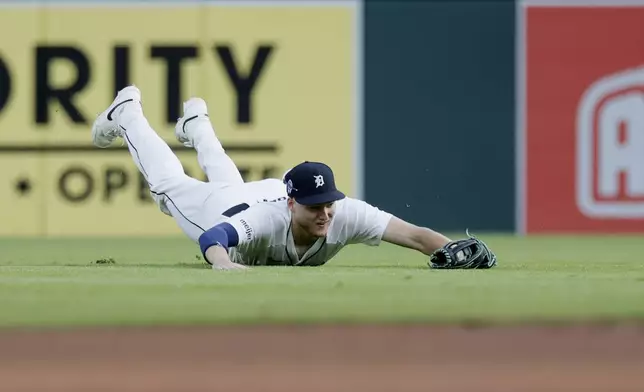 Detroit Tigers center fielder Parker Meadows makes a catch on a fly ball hit by Colorado Rockies' Brenton Doyle during the first inning of a baseball game, Wednesday, Sept. 11, 2024, in Detroit. (AP Photo/Duane Burleson)