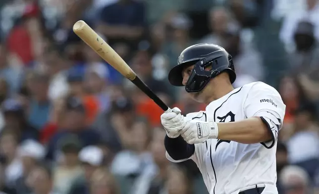 Detroit Tigers' Spencer Torkelson hits an RBI-single to drive in Kerry Carpenter against the Colorado Rockies during the first inning of a baseball game, Wednesday, Sept. 11, 2024, in Detroit. (AP Photo/Duane Burleson)