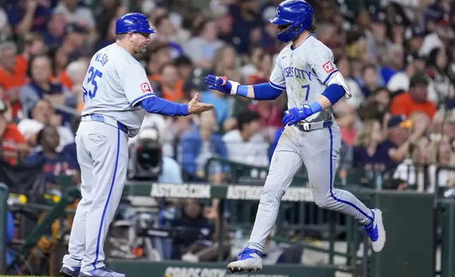 Kansas City Royals' Bobby Witt Jr. (7) celebrates after his solo home run against the Houston Astros with third base coach Vance Wilson, left, during the eighth inning of a baseball game Saturday, Aug. 31, 2024, in Houston. (AP Photo/Eric Christian Smith)