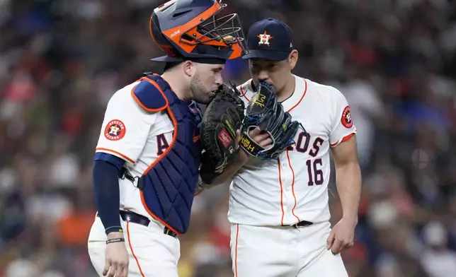 Houston Astros starting pitcher Yusei Kikuchi (16) talks to catcher Yainer Diaz during the sixth inning of a baseball game against the Kansas City Royals, Saturday, Aug. 31, 2024, in Houston. (AP Photo/Eric Christian Smith)