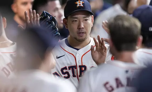 Houston Astros starting pitcher Yusei Kikuchi celebrates in the dugout after completing the seventh inning against the Kansas City Royals in a baseball game Saturday, Aug. 31, 2024, in Houston. (AP Photo/Eric Christian Smith)