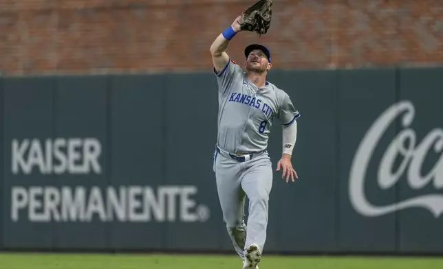 Kansas City Royals outfielder Robbie Grossman catches a pop fly hit by Atlanta Braves' Matt Olson in the fourth inning of a baseball game, Saturday, Sept. 28, 2024, in Atlanta. (AP Photo/Jason Allen)