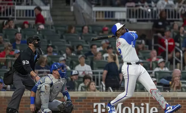 Atlanta Braves' Jorge Soler hits a double to center field in the fourth inning of a baseball game against the Kansas City Royals, Saturday, Sept. 28, 2024, in Atlanta. (AP Photo/Jason Allen)