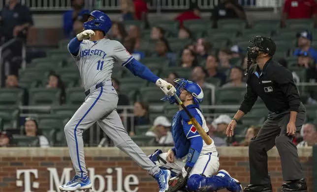 Kansas City Royals' Maikel Garcia looks to his hit to see if it stays within play in the first inning of a baseball game against the Atlanta Braves, Saturday, Sept. 28, 2024, in Atlanta. (AP Photo/Jason Allen)