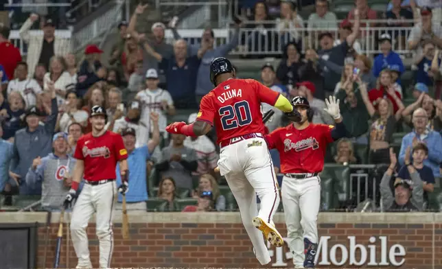 Atlanta Braves' Marcell Ozuna scores after an error in the eighth inning of a baseball game against the Kansas City Royals, Friday, Sept. 27, 2024, in Atlanta. (AP Photo/Jason Allen)