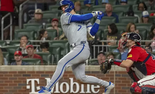 Kansas City Royals' Bobby Witt Jr. swings and hits a ball foul in the seventh inning of a baseball game against the Kansas City Royals, Friday, Sept. 27, 2024, in Atlanta. (AP Photo/Jason Allen)