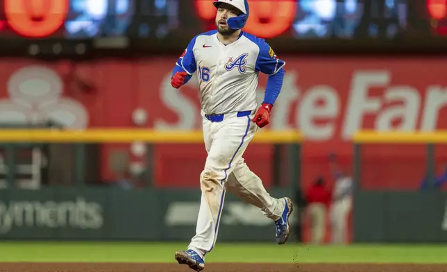 Atlanta Braves' Travis d'Arnaud rounds second base after hitting a walkoff home run to win a baseball game against the Kansas City Royals, Saturday, Sept. 28, 2024, in Atlanta. (AP Photo/Jason Allen)