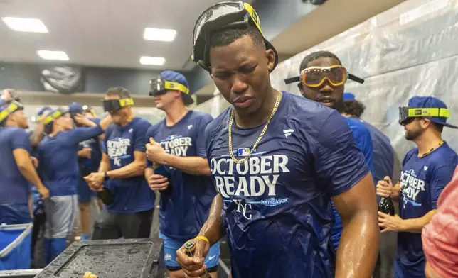 Kansas City Royals outfielder Dairon Blanco (44) celebrates in the locker room after a baseball game against the Atlanta Braves, Friday, Sept. 27, 2024, in Atlanta. (AP Photo/Jason Allen)