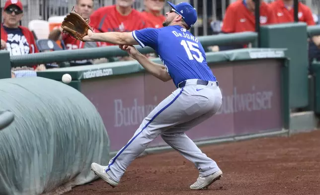 Kansas City Royals third baseman Paul DeJong goes after a foul ball by Washington Nationals' Joey Gallo during the second inning of a baseball game, Thursday, Sept. 26, 2024, in Washington. (AP Photo/Nick Wass)