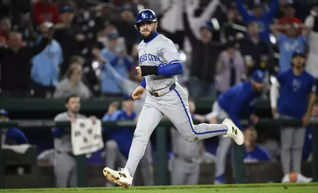 Kansas City Royals' Kyle Isbel runs towards home to score on a throwing error by Washington Nationals shortstop Nasim Nunez during the 10th inning of a baseball game, Tuesday, Sept. 24, 2024, in Washington. (AP Photo/Nick Wass)