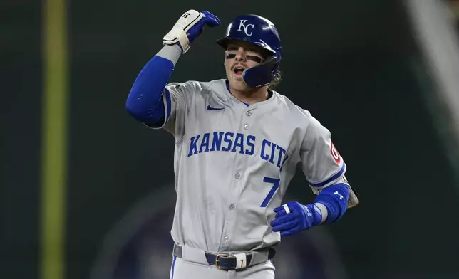 Kansas City Royals' Bobby Witt Jr. gestures near first base after he singled during the first inning of a baseball game against the Washington Nationals, Tuesday, Sept. 24, 2024, in Washington. (AP Photo/Nick Wass)