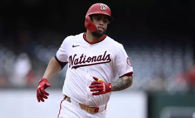 Washington Nationals' Luis Garcia Jr. rounds the bases on his three-run home run during the third inning of a baseball game against the Kansas City Royals, Thursday, Sept. 26, 2024, in Washington. (AP Photo/Nick Wass)