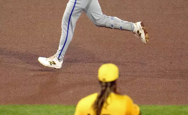 Kansas City Royals' Kyle Isbelk, top, rounds the bases after hitting a solo home run off Pittsburgh Pirates starting pitcher Luis L. Ortiz (48) during the fourth inning of a baseball game in Pittsburgh, Friday, Sept. 13, 2024. (AP Photo/Gene J. Puskar)