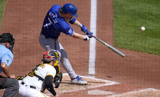 Kansas City Royals' Bobby Witt Jr. (7) hits a sacrifice fly off Pittsburgh Pirates starting pitcher Mitch Keller, scoring Maikel Garcia from third, during the fifth inning of a baseball game in Pittsburgh, Saturday, Sept. 14, 2024. (AP Photo/Gene J. Puskar)