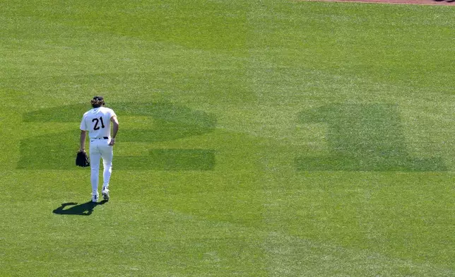 Pittsburgh Pirates' Billy Cook takes his position in right field at PNC Park during a baseball game against the Kansas City Royals in Pittsburgh, Sunday, Sept. 15, 2024. A No. 21 was cut into right field and all Pirates wore the uniform number in honor of Roberto Clemente Day. (AP Photo/Gene J. Puskar)