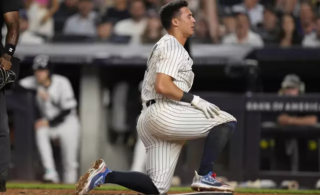 New York Yankees' Anthony Volpe reacts after being called out at home plate during the seventh inning of a baseball game against the Kansas City Royals at Yankee Stadium Wednesday, Sept. 11, 2024, in New York. (AP Photo/Seth Wenig)