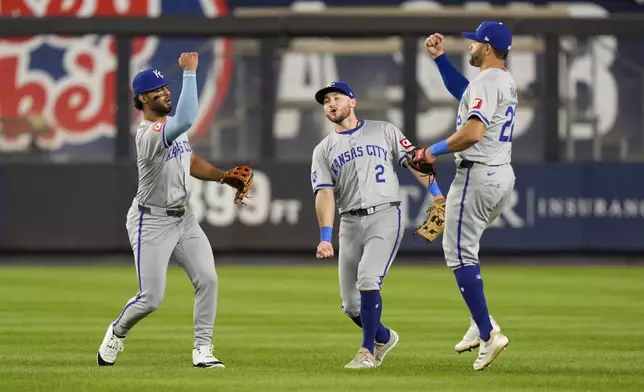 Kansas City Royals outfielders MJ Melendez, left, Garrett Hampson and Tommy Pham celebrate after a baseball game against the New York Yankees at Yankee Stadium Tuesday, Sept. 10, 2024, in New York. (AP Photo/Seth Wenig)