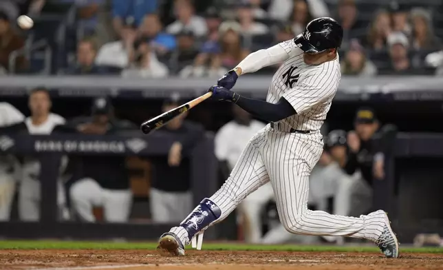 New York Yankees' Juan Soto hits a two-run home run during the sixth inning of a baseball game against the Kansas City Royals at Yankee Stadium, Wednesday, Sept. 11, 2024, in New York. (AP Photo/Seth Wenig)