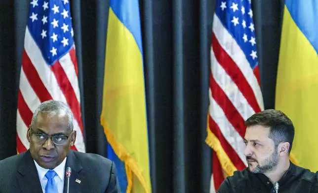 Defense Secretary Lloyd Austin, left and Ukrainian President Volodymyr Zelenskyy sit next to each other during the Ukraine Contact Group meeting at Ramstein Air Base, Friday, Sept.6, 2024. (Andreas Arnold/dpa via AP)