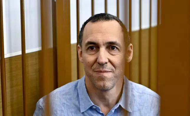 French citizen Laurent Vinatier sits in a cage in a courtroom in the Zamoskvoretsky District Court in Moscow, Russia, Monday, Sept. 16, 2024. (AP Photo/Dmitry Serebryakov)