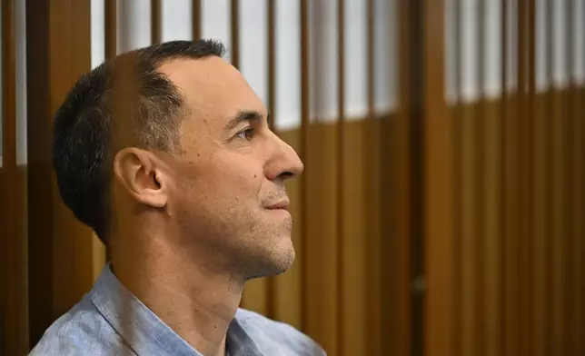 French citizen Laurent Vinatier sits in a cage in a courtroom in the Zamoskvoretsky District Court in Moscow, Russia, Monday, Sept. 16, 2024. (AP Photo/Dmitry Serebryakov)