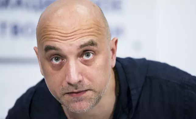 FILE - Russian writer and publicist Zakhar Prilepin attends a news conference in Moscow, Russia, Tuesday, Feb. 21, 2017. (AP Photo/Alexander Zemlianichenko, File)