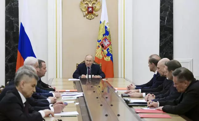 Russian President Vladimir Putin, center, speaks at the Security Council meeting on nuclear deterrence at the Kremlin at the Kremlin in Moscow, Russia, Wednesday, Sept. 25, 2024. (Alexei Nikolsky, Sputnik, Kremlin Pool Photo via AP)