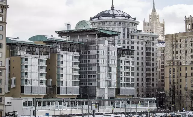 FILE - The British Embassy building, center, with the Russian Foreign Ministry building, second right, in Moscow, Russia, Friday, March 16, 2018. (AP Photo/Pavel Golovkin, File)