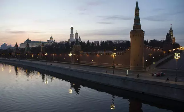 FILE - The Kremlin and embankment of the Moscow River are seen during sunset in Moscow, Russia, on Saturday, March, 28, 2020. (AP Photo, File)