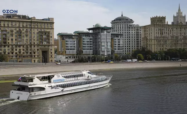 A boats floats past the British Embassy building, centre, in Moscow, Russia, Friday, Sept. 13, 2024, with the Russian Foreign Ministry building in the right. (AP Photo)