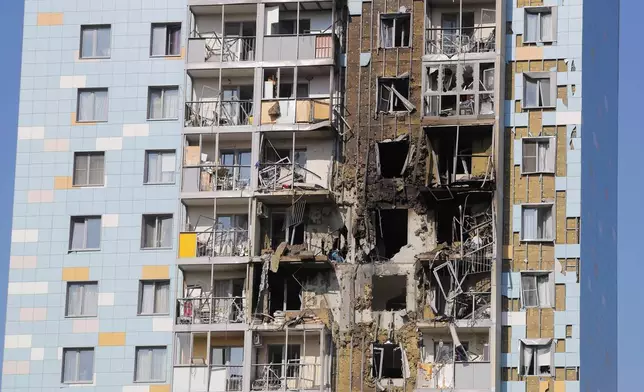 A view of the site of the damaged multi-storey residential building following an alleged Ukrainian drone attack in Ramenskoye, outside Moscow, Moscow region, Russia, on Tuesday, Sept. 10, 2024. (AP Photo)