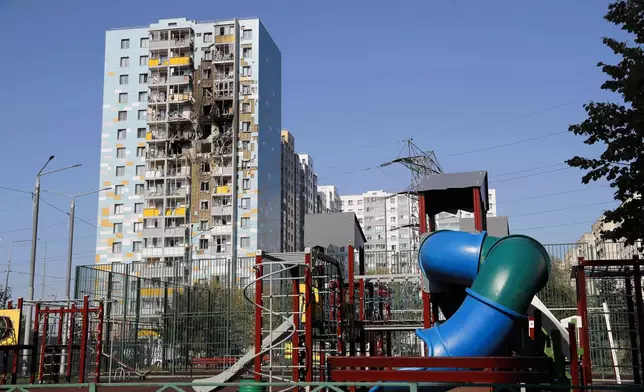 A view of the site of the damaged multi-storey residential building with the children's playground, foreground, following an alleged Ukrainian drone attack in Ramenskoye, outside Moscow, Moscow region, Russia, on Tuesday, Sept. 10, 2024. (AP Photo)