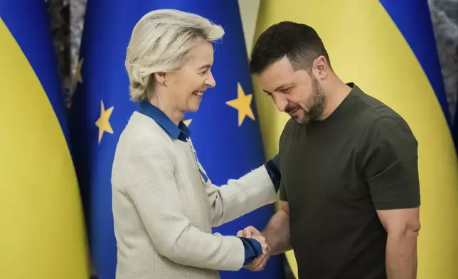 Ursula von der Leyen, left, President of the European Commission, shakes hands with Ukrainian President Volodymyr Zelenskyy, following a joint press conference in Kyiv, Ukraine, Friday, Sept. 20, 2024. (Christoph Soeder, Pool Photo via AP)