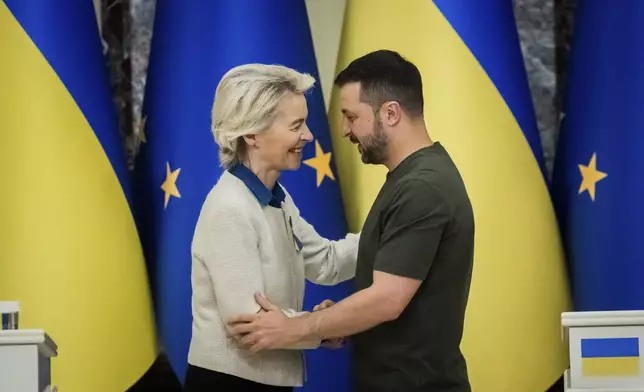 Ursula von der Leyen, left, President of the European Commission, greets Ukrainian President Volodymyr Zelenskyy, following a joint press conference in Kyiv, Ukraine, Friday, Sept. 20, 2024. (Christoph Soeder, Pool Photo via AP)