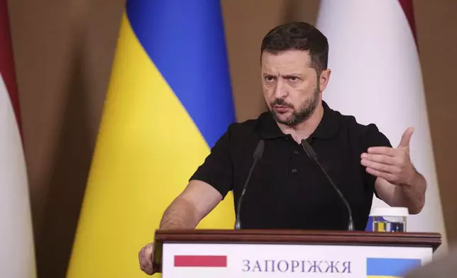 Ukrainian President Volodymyr Zelenskyy speaks during a joint press conference with Netherlands' Prime Minister Dick Schoof in Zaporizhzhia, Ukraine, Monday Sept. 2, 2024. (AP Photo/Evgeniy Maloletka)