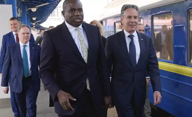 U.S. Secretary of State Antony Blinken and British Foreign Secretary David Lammy arrive at the train station in Kyiv, Ukraine, Wednesday, Sept. 11, 2024. (AP Photo/Mark Schiefelbein, Pool)